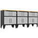 Armadillo Tough 4-Piece Heavy-Duty Garage Cabinet Set with Steel Gear Locker & Workbench Grey from the front showing the locking cabinets and drawers for this garage workbench
