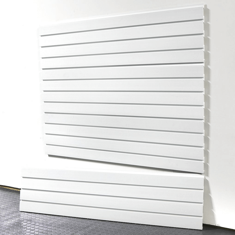 4-foot Brite White Basic Duty slatwall panels installed on a garage wall, featuring a smooth white finish and interlocking design by Oura Decor.