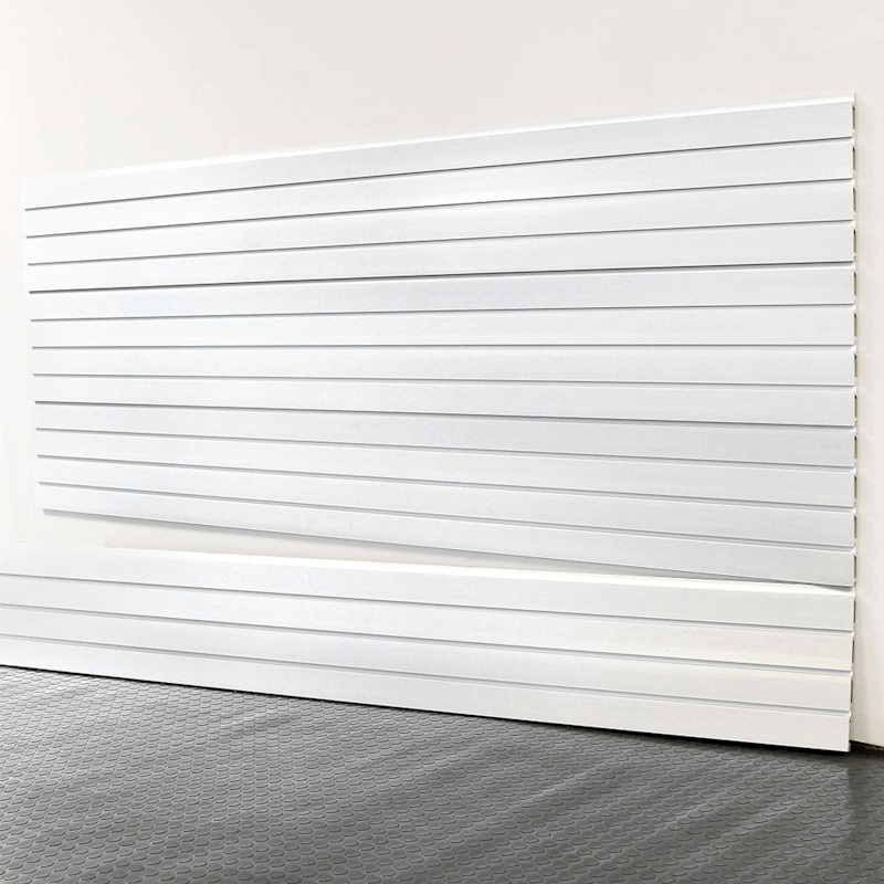 8-foot Brite White Basic Duty slatwall panels installed on a garage wall, showcasing a clean white finish and interlocking channel design by Oura Decor.