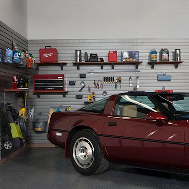 Garage slatwall with shelves holding tools