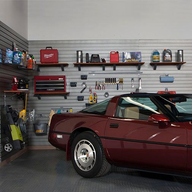 Garage slatwall with shelves holding tools 