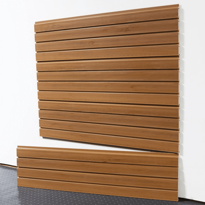 Rustic cedar slatwall panels mounted on a garage wall, showing interlocking design and smooth wood finish.