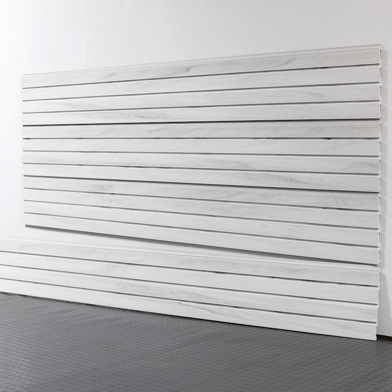 8-foot whitewood slatwall panels installed on a garage wall, featuring a natural wood-grain texture and interlocking design by Oura Decor.