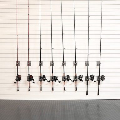 Eight fishing rods with different colored lines and black spincast reels mounted on a white slatwall.