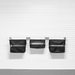 Three black mesh hanging utility pouches mounted on a white paneled wall with metal brackets.