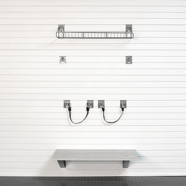A wall-mounted shelving system shown on a white slatted wall, including two wire baskets, four wall hooks with cords, and a lower shelf, all in a clean studio-style presentation.