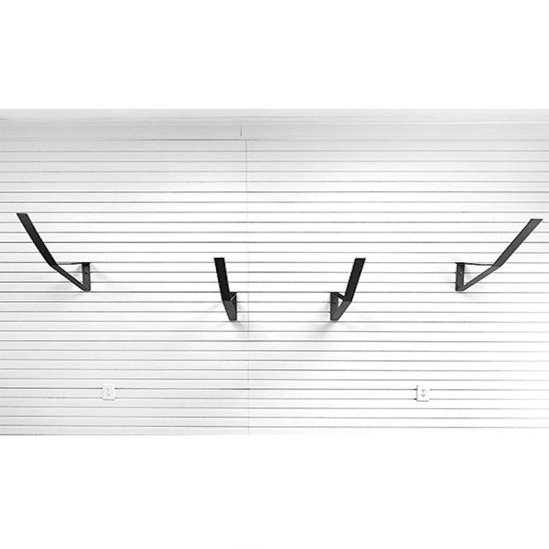Four black metal wall hooks mounted on a white slatwall panel.