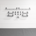 A set of dark gray metal wire baskets and hooks mounted on a white slatted wall, with a gray textured floor below.