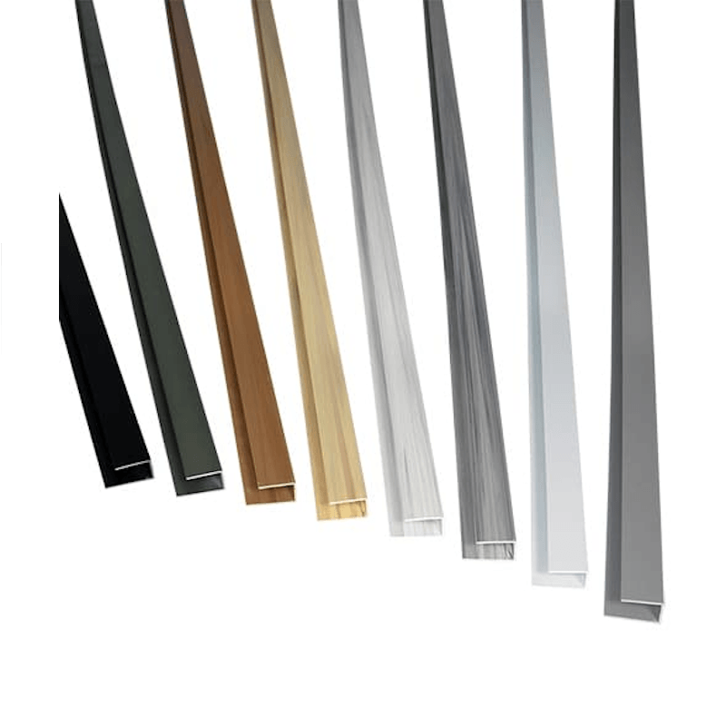 Six long, narrow metal or wood trim profiles shown standing upright on a white background, in black, dark gray, medium brown, light natural wood, silver, and gray.