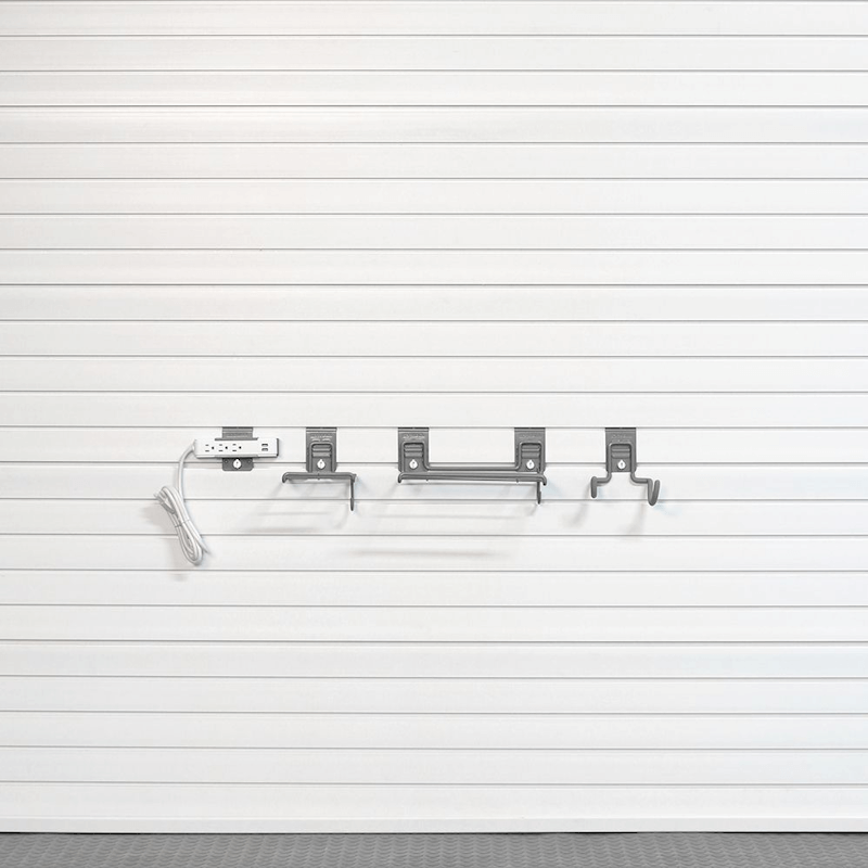Basic Tool Storage Bundle configuration illustrating minimal essential hooks, shelves, and a power strip bracket on a white slatwall.