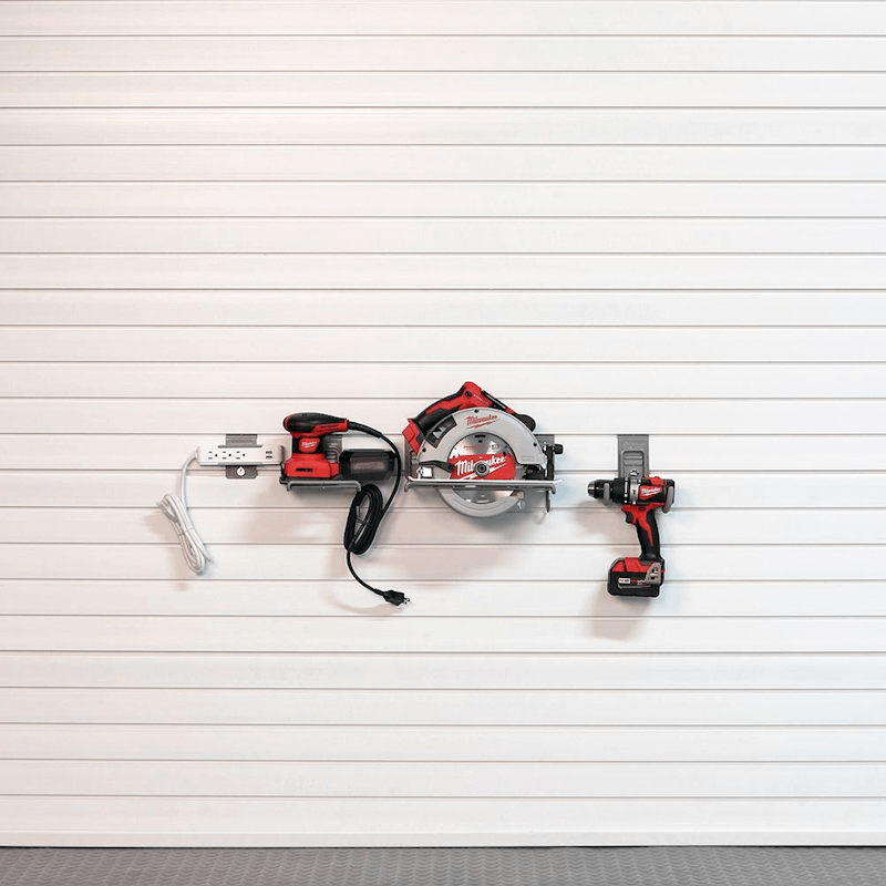 Tidy garage workbench area, utilizing the Basic Tool Bundle hooks and ledge shelf to keep essential daily tools and materials within reach.