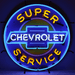 Neonetics Super Chevrolet Service neon sign with blue and yellow hand-blown glass neon over a full-color logo background dark showing off the neon lighting