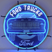 Neonetics Ford Trucks Square Body neon sign with white and blue hand-blown glass neon over a vintage truck background.
