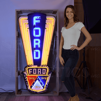 Massive Ford Jubilee Crest neon sign by Neonetics shown with a person to demonstrate the nearly 5-foot scale for garage decor.