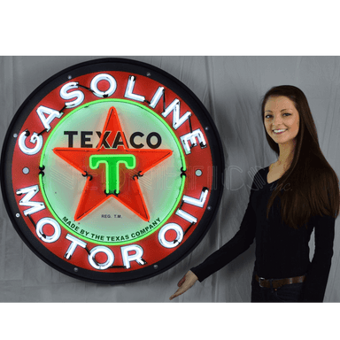 Large 3-foot Texaco Motor Oil neon sign shown with a person to demonstrate scale for garage wall decor.