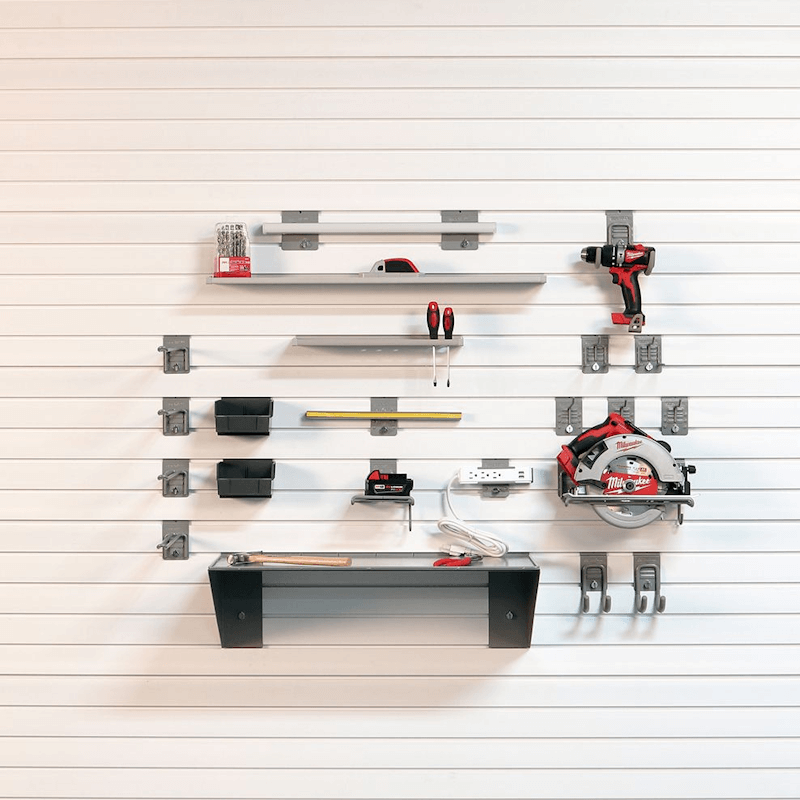 Lifestyle photo of the Premium Tool Bundle, showing drills, wrenches, and charging devices neatly organized near a workbench.