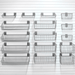 16-piece Deluxe Basket Bundle, showing a variety of deep, shallow, and angle wire baskets on a white slatwall.