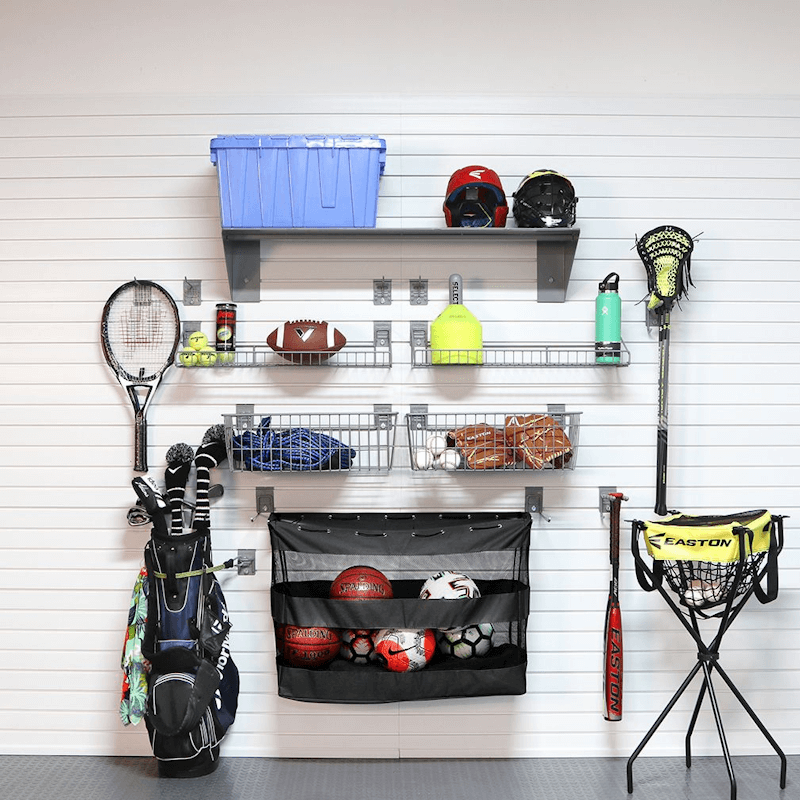 Staged family sports organization wall utilizing the Deluxe Bundle, showing balls, nets, and shoes neatly stored on shelves and in baskets.